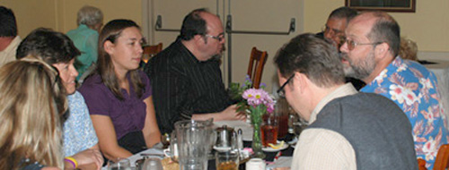 people talking at dinner meeting