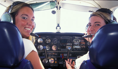 girls in airplane cockpit