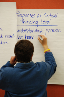 man writing on flipchart